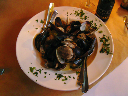 A simple appetizer of steamed mussels and clams fits the bill at The Pink Door in the Pike Place Market. 