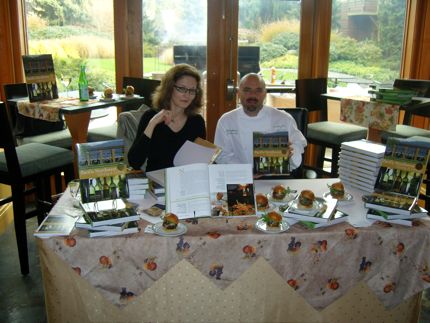 Executive chef Bobby Moore and Braiden Rex-Johnson sign books at Barking Frog in Woodinville, Wash. 